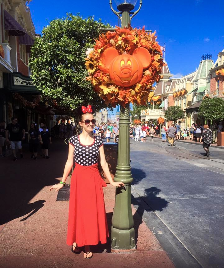 Halloween at Disney on Main street dressed as minnie mouse