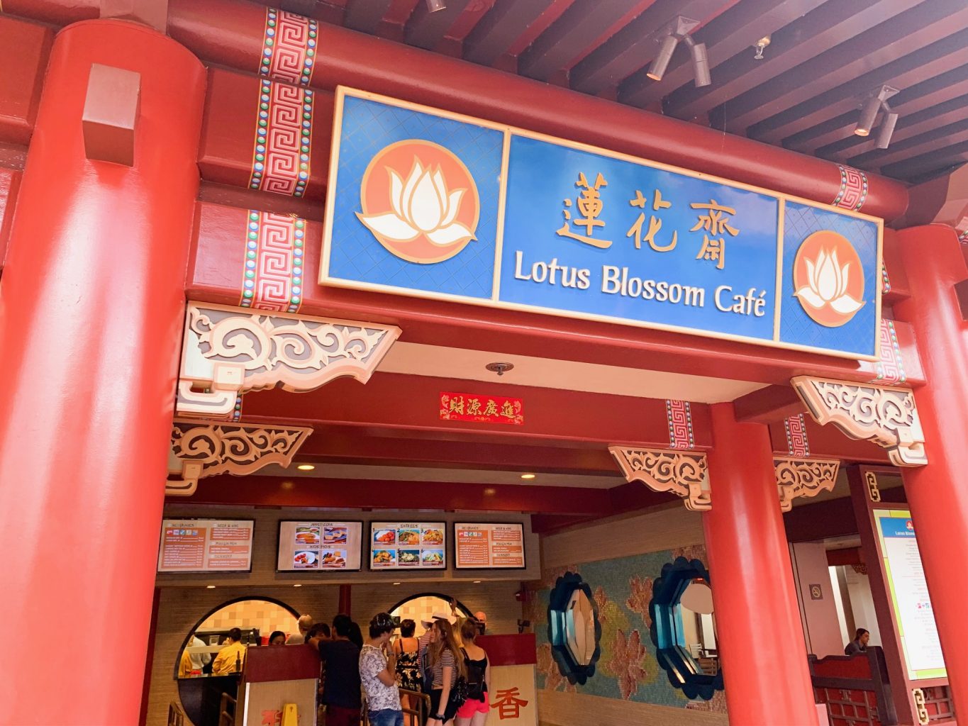 red decorative sign for lotus blossom cafe epcot quick service