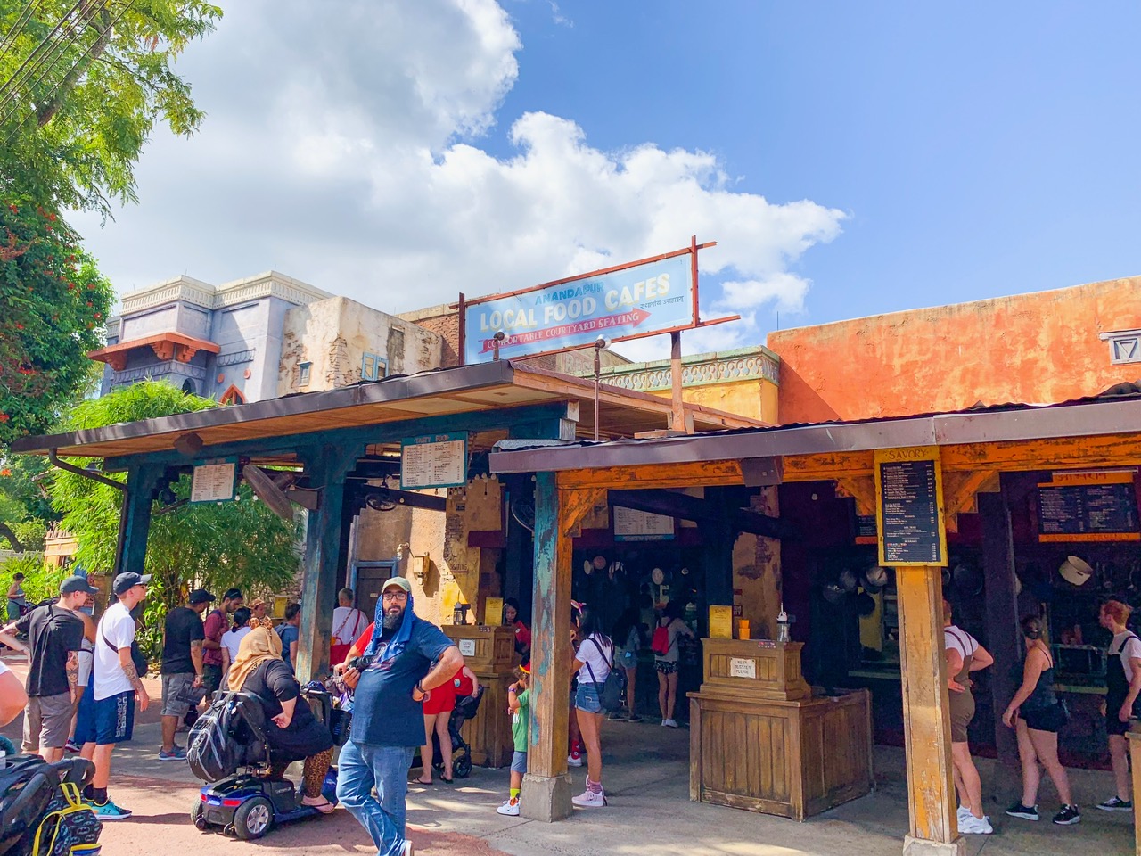 Yak and Yeti Local Markets sign and people in line to order at kiosks Animal Kingdom quick service 