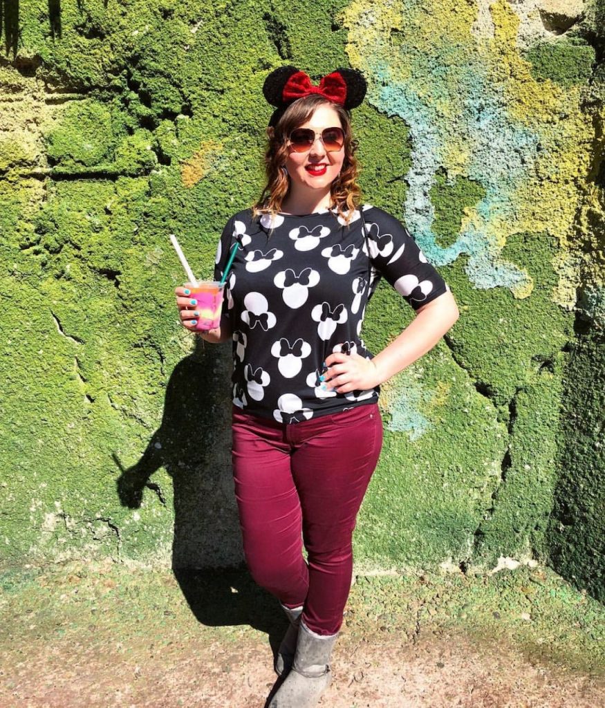 woman holding colorful slushy drink quick service at animal kingdom