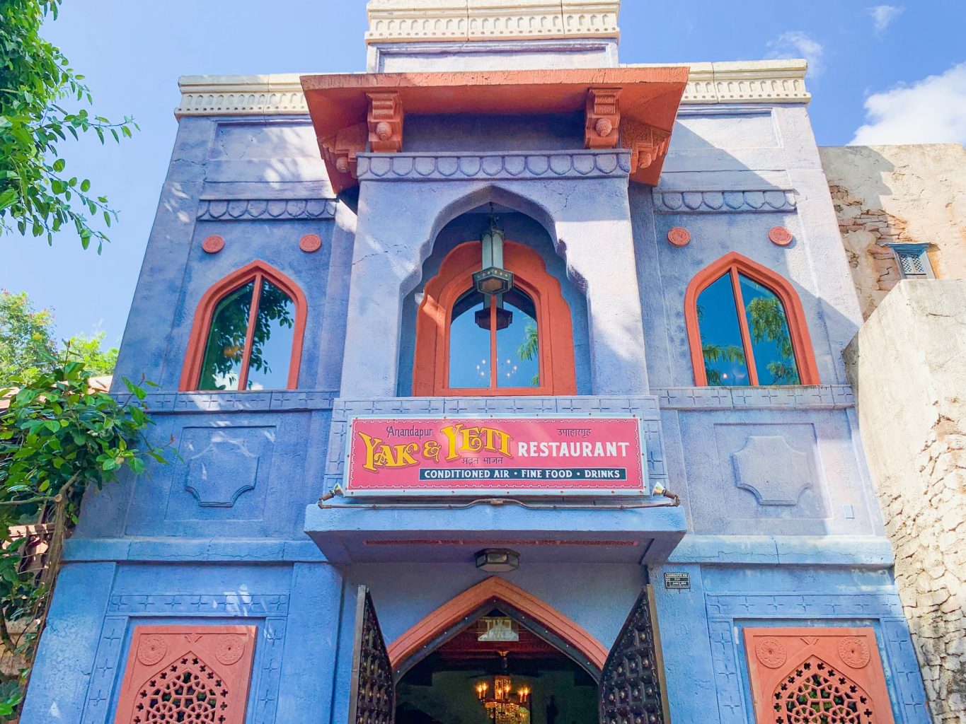 The Asian inspired blue and red exterior of the Yak and Yeti restaurant is the entrance to one of the best Animal Kingdom restaurants.