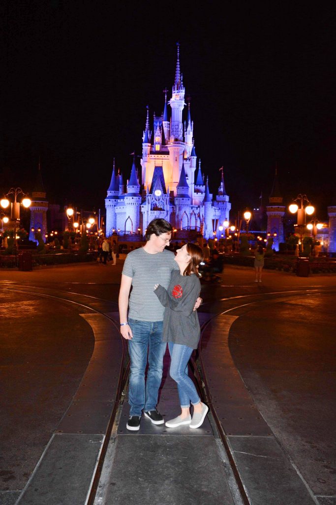 Photo in front of Cinderella's Castle lit up at night