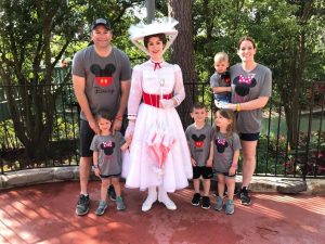 family wearing classic Disney shirts with Mary Poppins