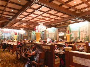 wood-filled dining area with Italian murals on the walls