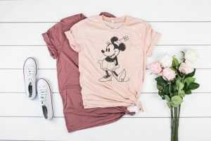 two pink shirts with sketch of Minnie mouse