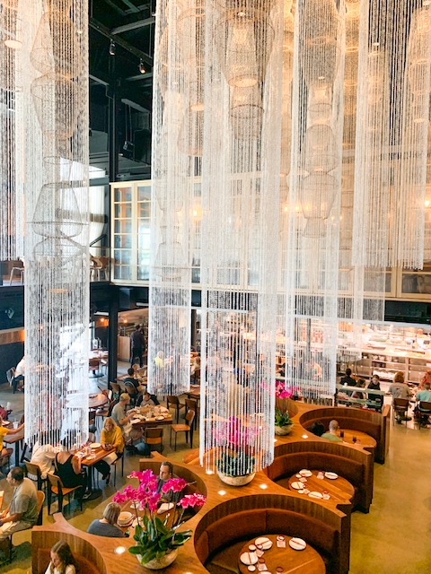 long hanging chandeliers over tables and chairs at Morimoto Asia best restaurants at Disney Springs