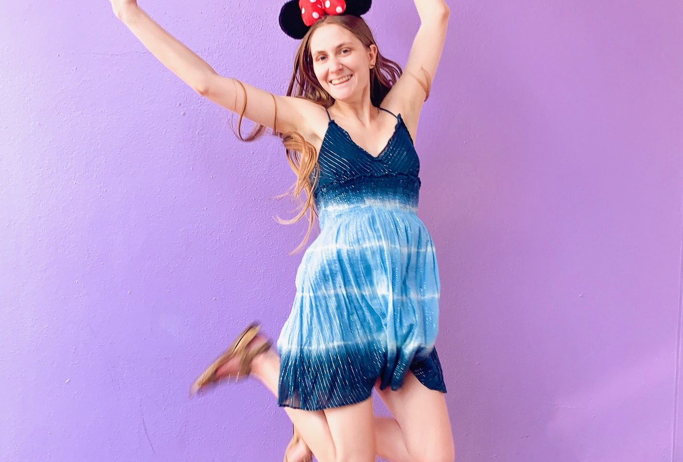 jumping on the purple Disney wall
