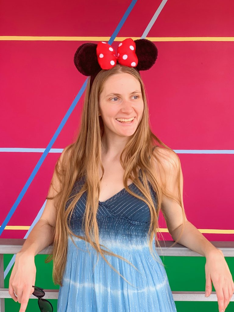 Posing on the Carousel of Progress Disney wall