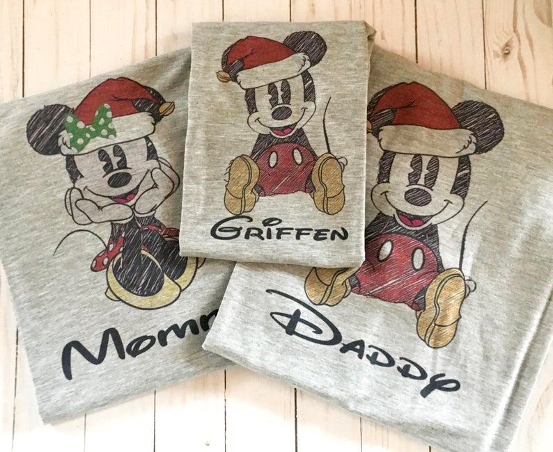 Vintage Mickey House family shirts for Christmas on a table