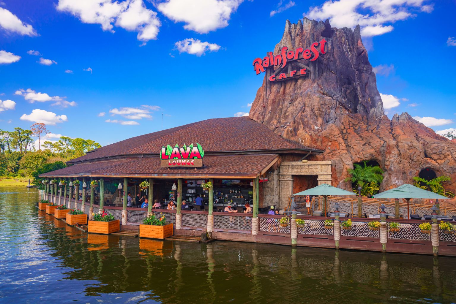 Exterior of Rainforest Cafe with volcano and bar at Disney springs