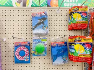 Hooks with different types of pool floaties