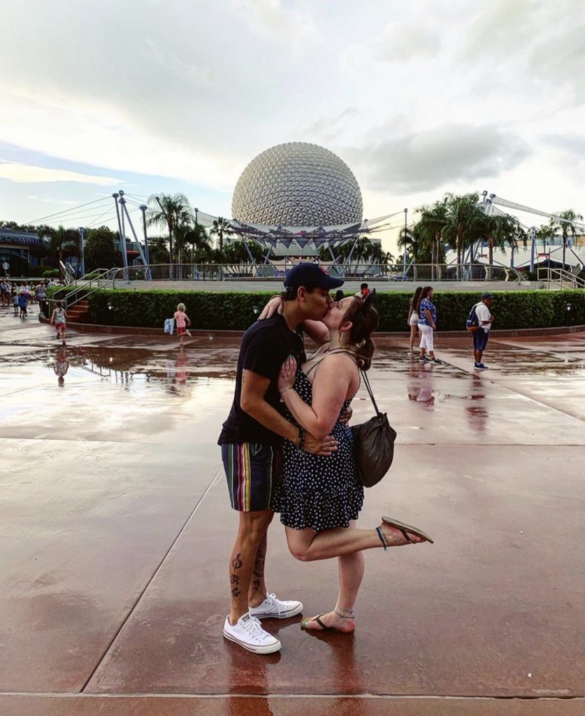 Photo of couple kissing in Disney World