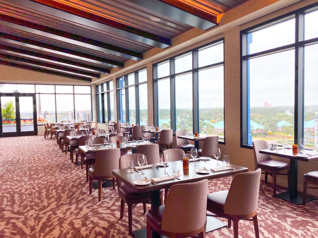 chairs and tables in beautiful restaurant with window views