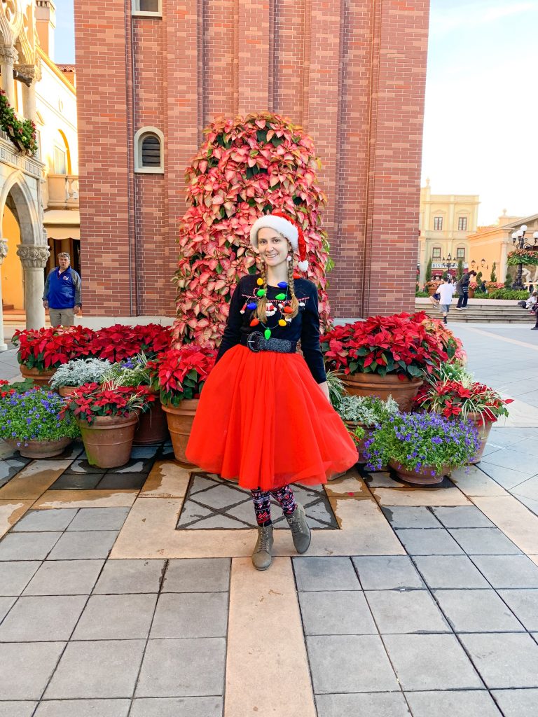 Woman dressed in festive outfit for christmas at disney world