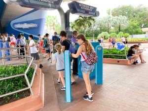 tapping magicband at spaceship earth