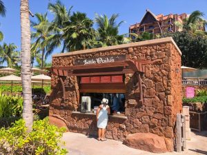 lady ordering at lava rock-built Little Opihi's Disney Aulani Review