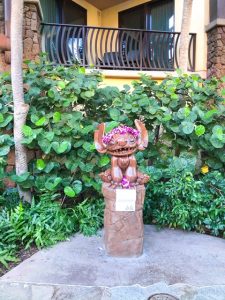 wooden Stitch statue with flower leis Disney Aulani Review