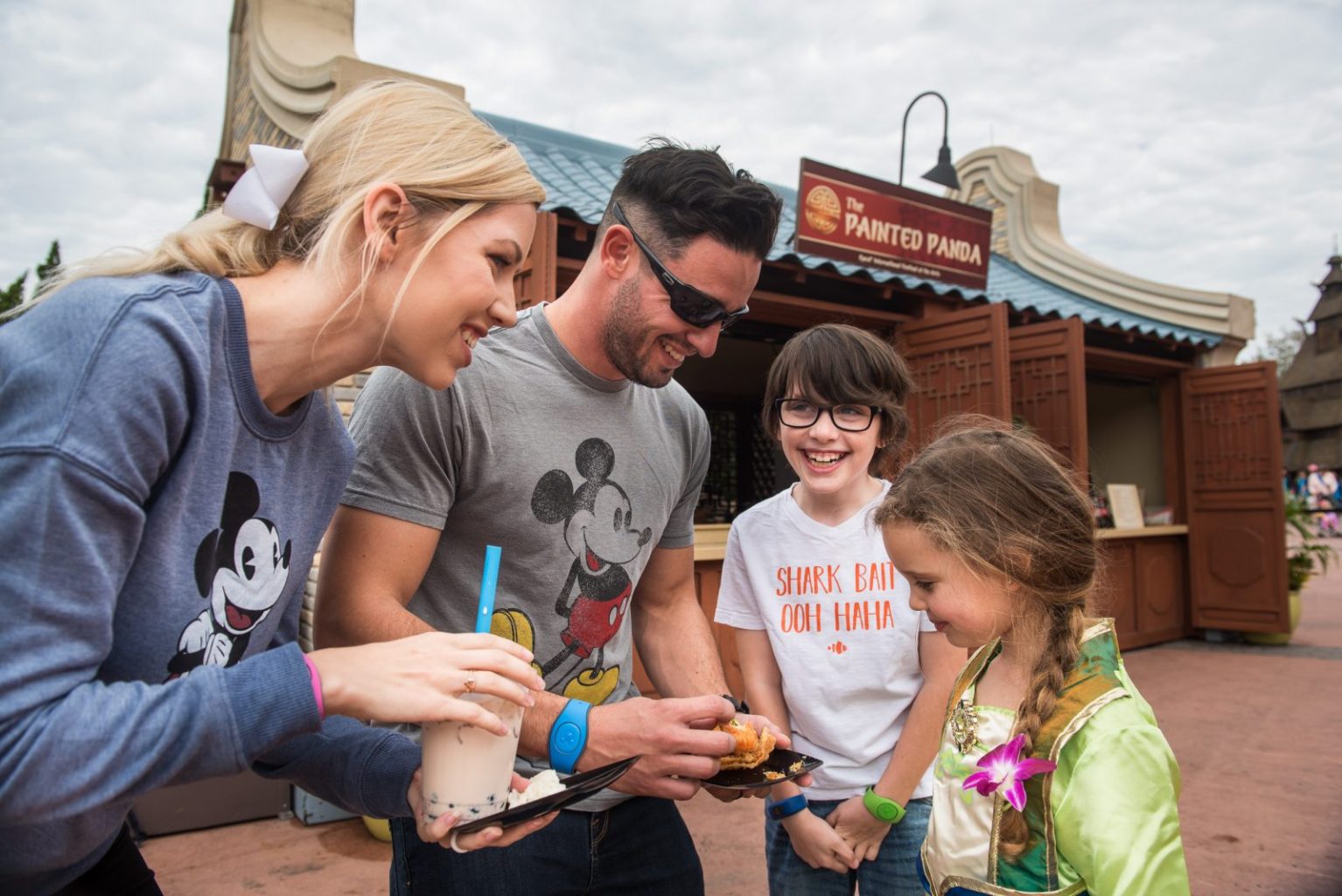 Family enjoying food at Epcot's Festival Of The Arts