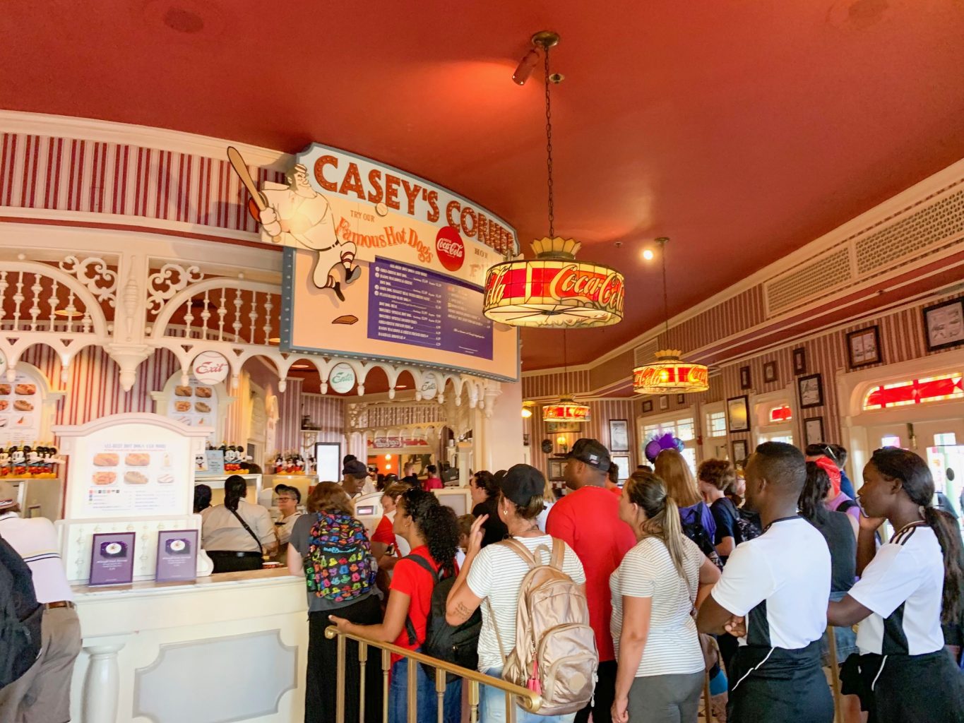 A long queue for one of the most iconic and best Magic Kingdom quick service restaurants, Casey's Corner