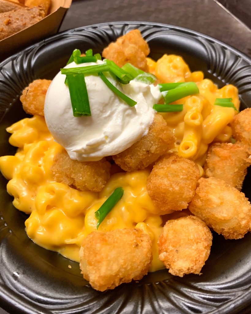 This photo is of Mac and cheese tater tots (featuring green onions and sour cream) that comes from one of the best Magic Kingdom Restaurants.