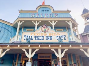 light blue country-style exterior of Pecos Bill Magic Kingdom Restaurants