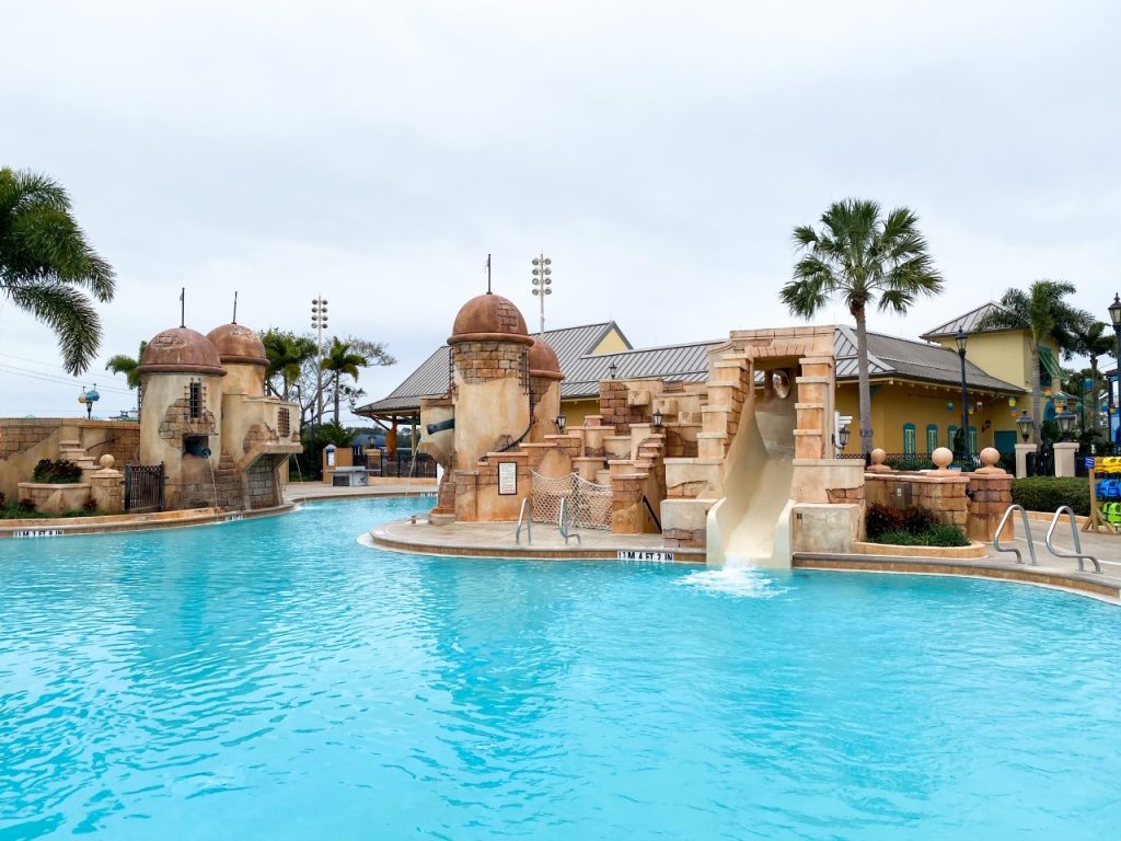 themed pool and blue water at disney moderate resort caribbean beach