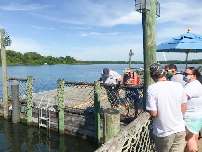 people on a pier at fort wilderness disney moderate resort