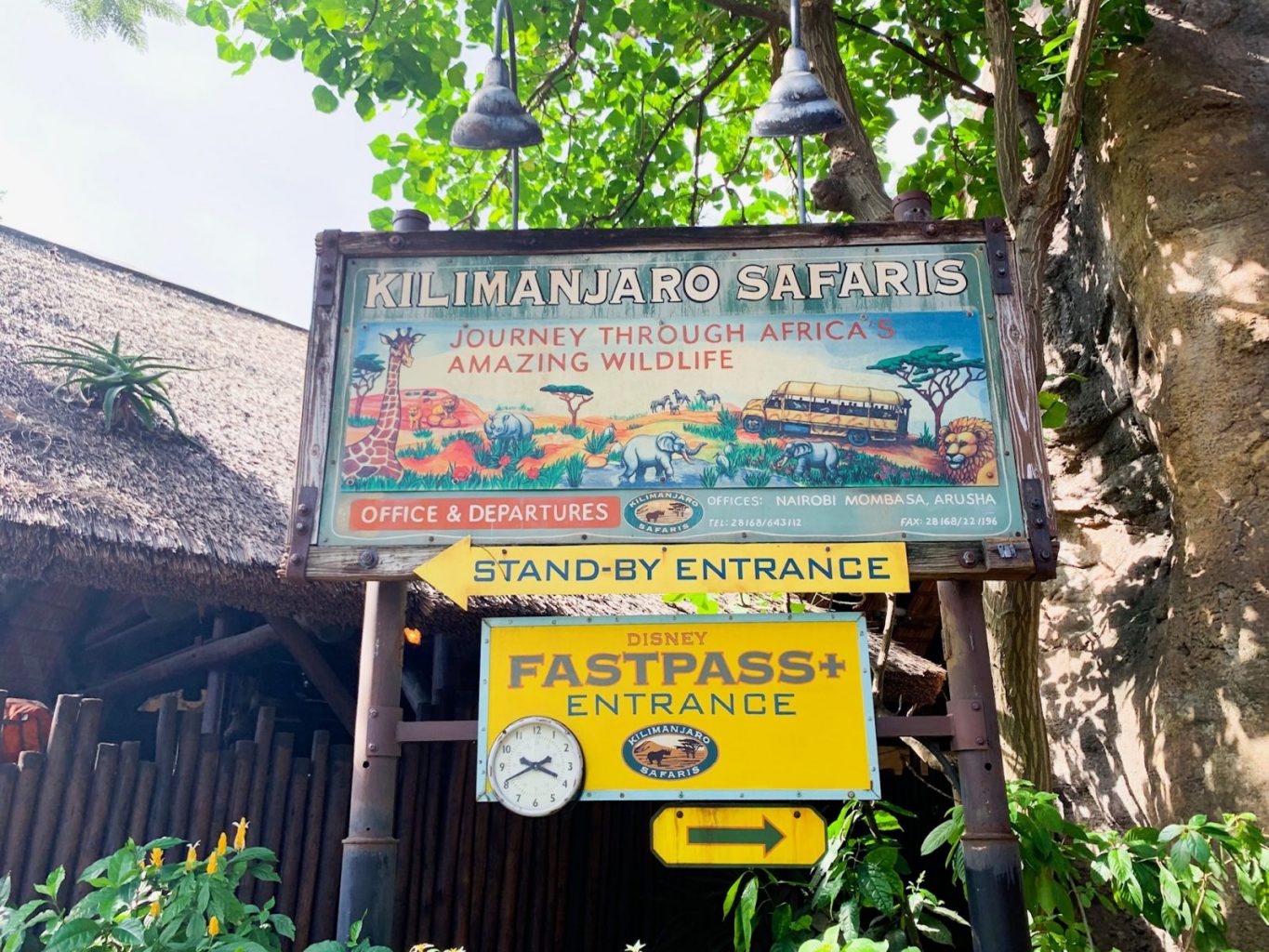 colorful yet old-looking sign for Kilamanjaro Safari