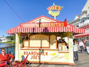 small red and green booth selling margaritas