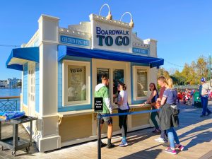 small waterfront booth with short line Disney Boardwalk