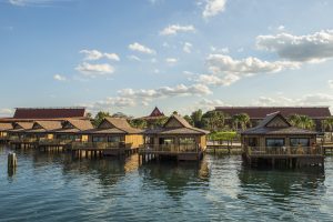 six island style bungalows over water Disney transportation