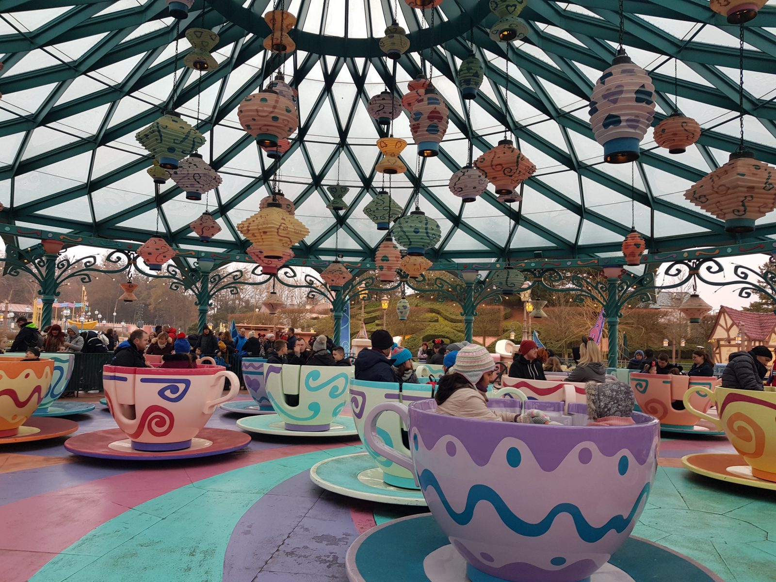 Guests riding the tea cups at Disneyland Paris