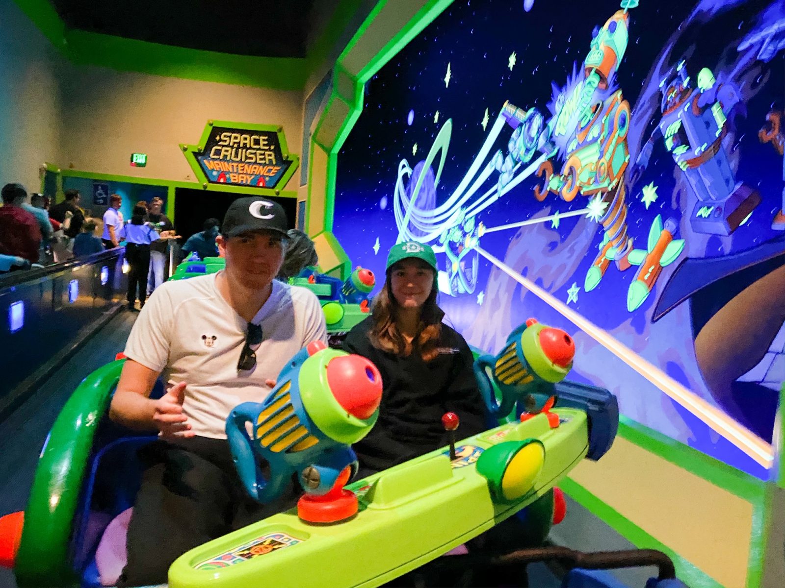 people on Buzz Lightyear Space Ranger Spin