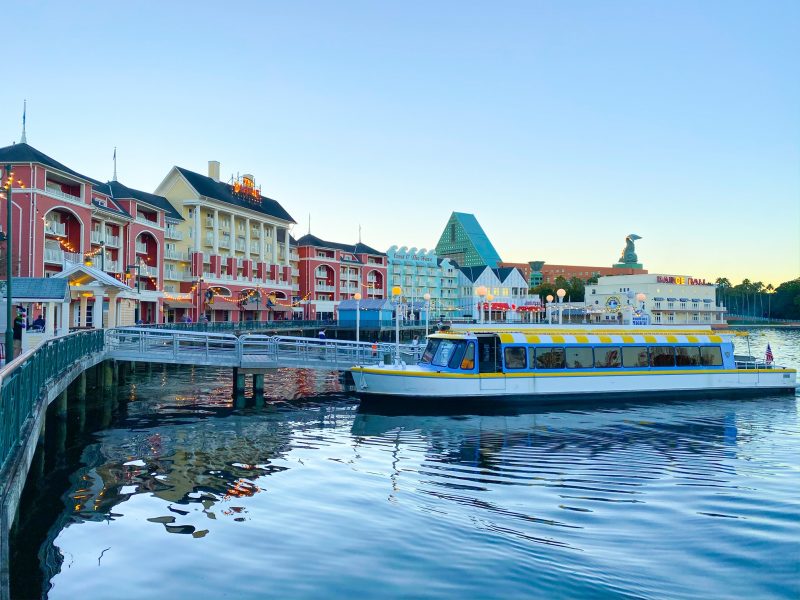colorful boat in front of large colorful buildings on boardwalk disney on a budget