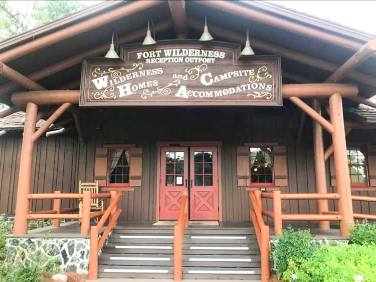 wooden style building with sign for camping best Disney World resorts 