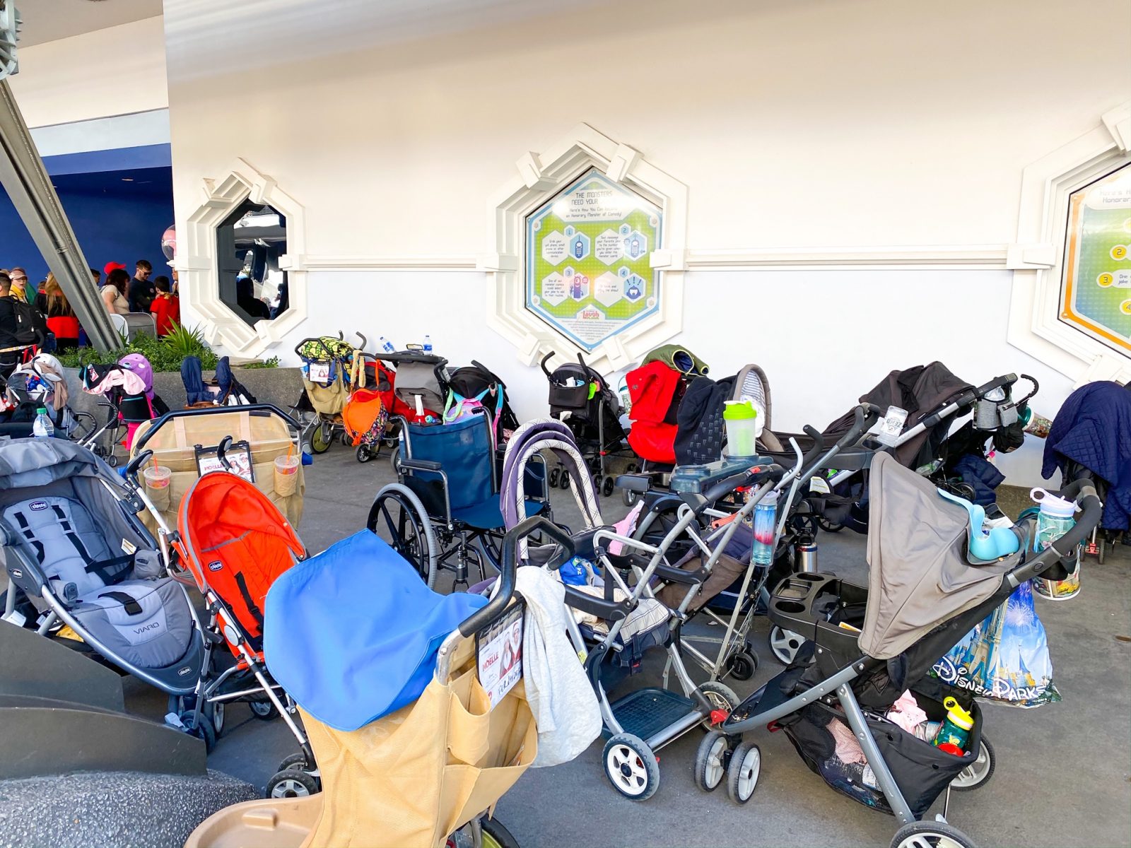 In Tomorrowland, strollers line up while awaiting their owners to get off a ride. Strollers at Disney are usually cornered into areas like this and can be moved. 