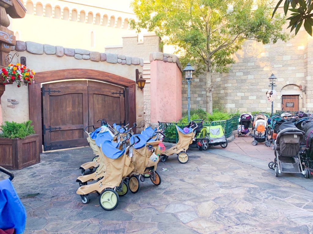 A photo of a tidy stroller park, where cast members organized Disney with toddlers so strollers don't get lost or in the way of other guests.