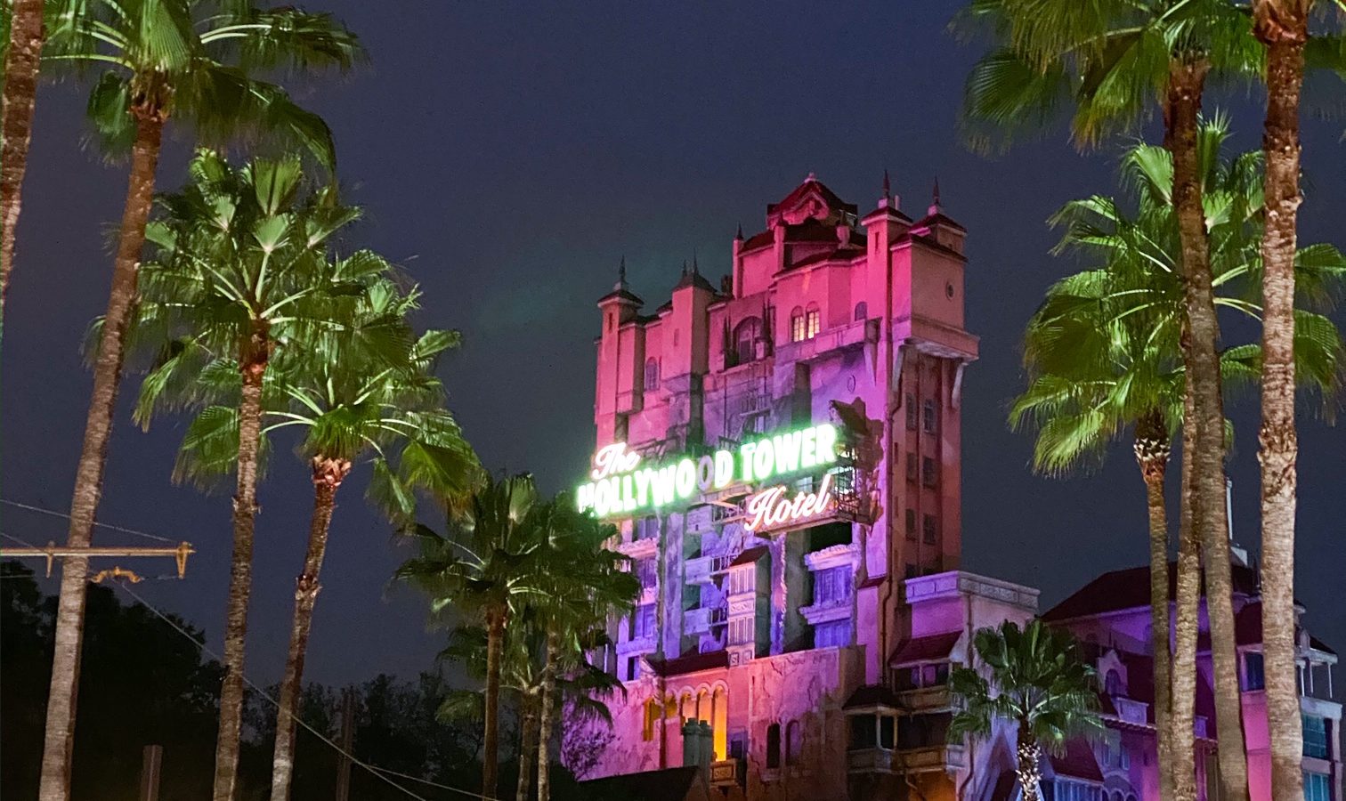 view from Sunset Boulevard of the Tower of Terror Hotel Ride at night