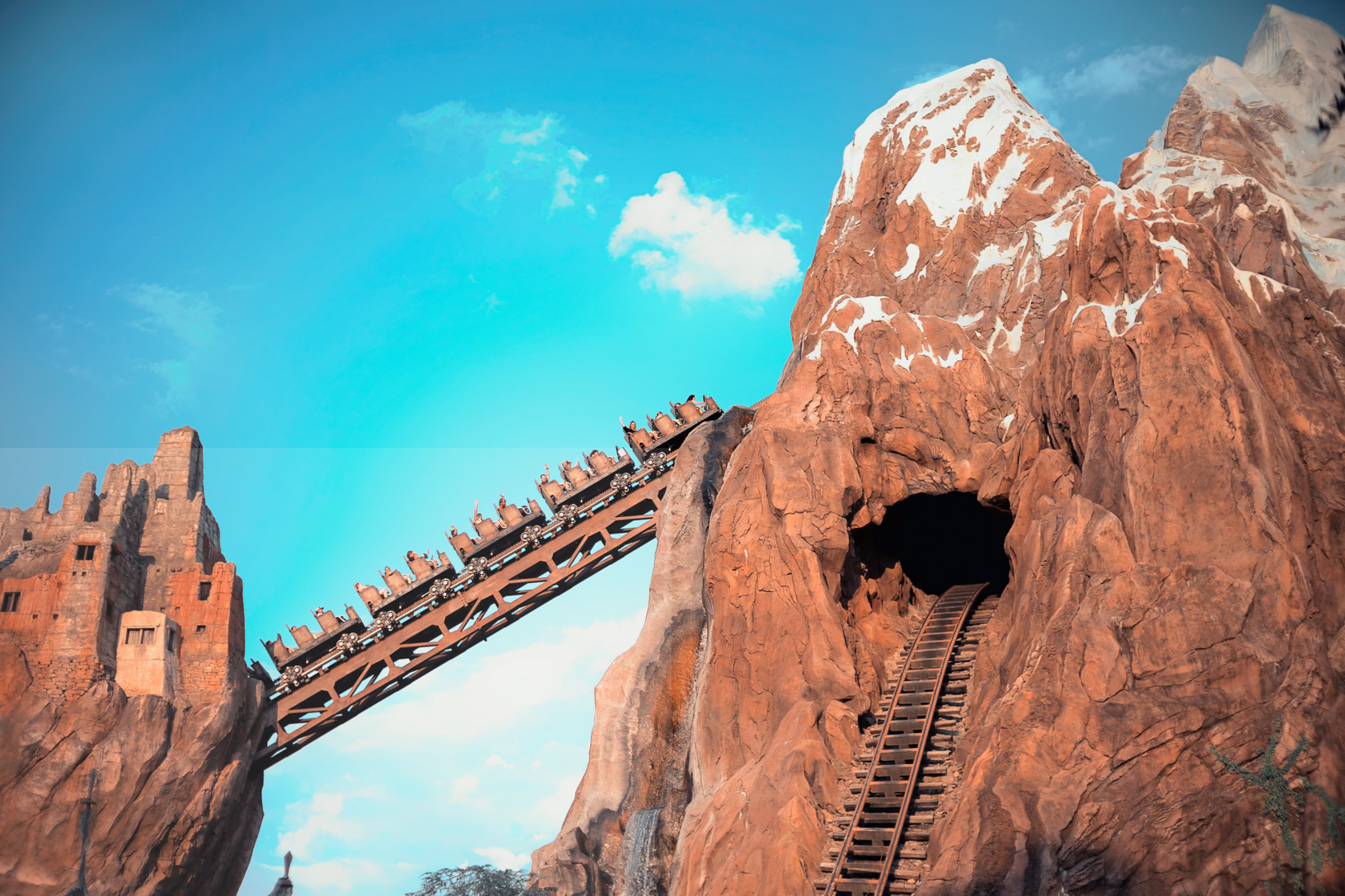 ground view of a train traveling up a hill on Expedition Everest 