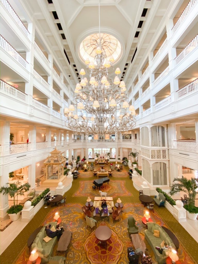 white grand lobby of hotel with huge chandelier;how to rent DVC points at Disney Deluxe resort