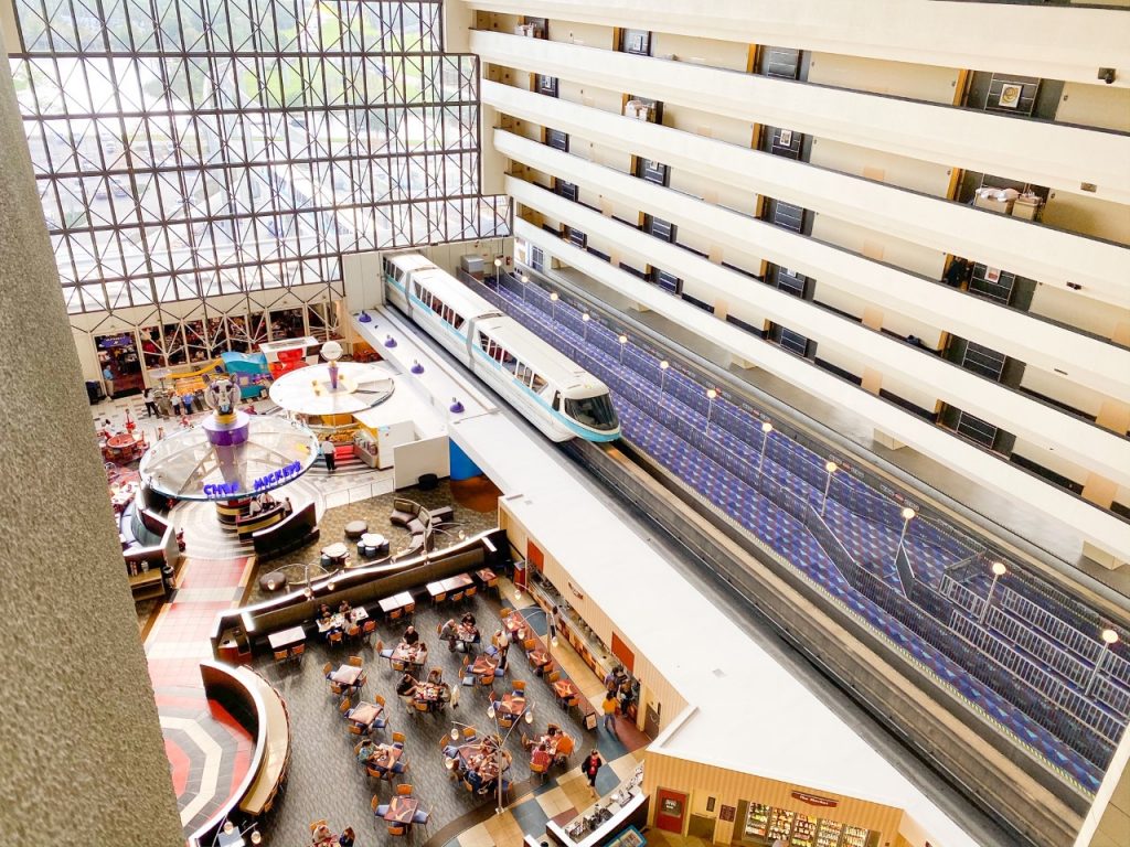 photo of the interior of the Contemporary resort, with the monorail moving through; how to rent DVC points at a Disney Deluxe resort