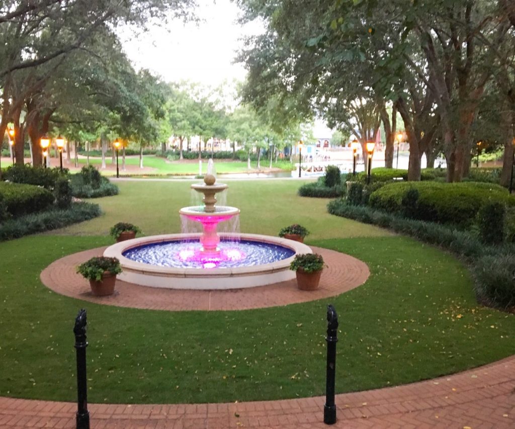 photo of a nicely lit fountain in the middle of a lawn at Port Orleans French Quarter best Disney resort for kids