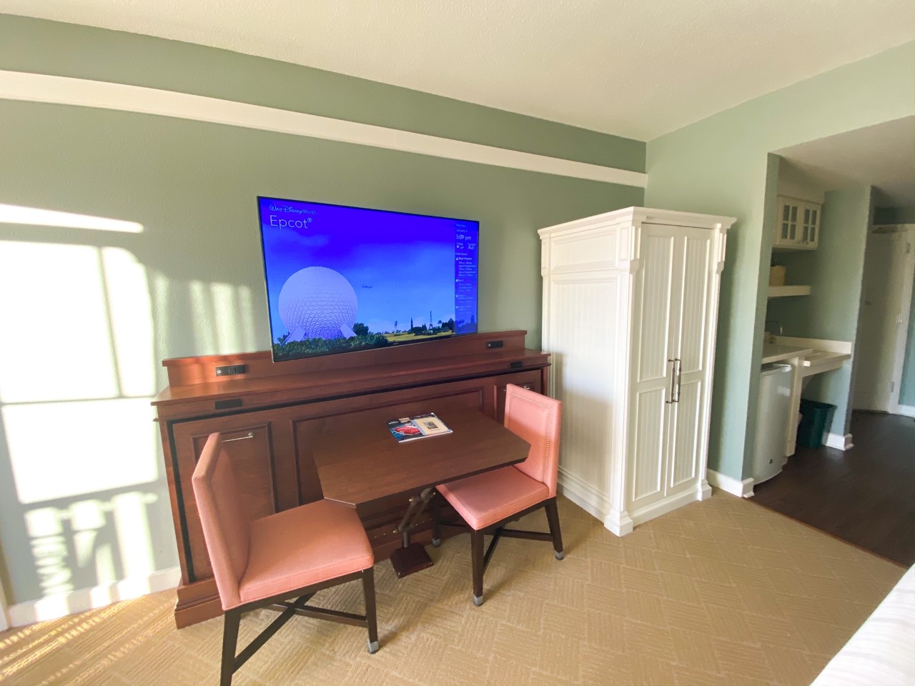 photo of table and chairs in a Disney resort room ideal for in room dining; tipping at Disney