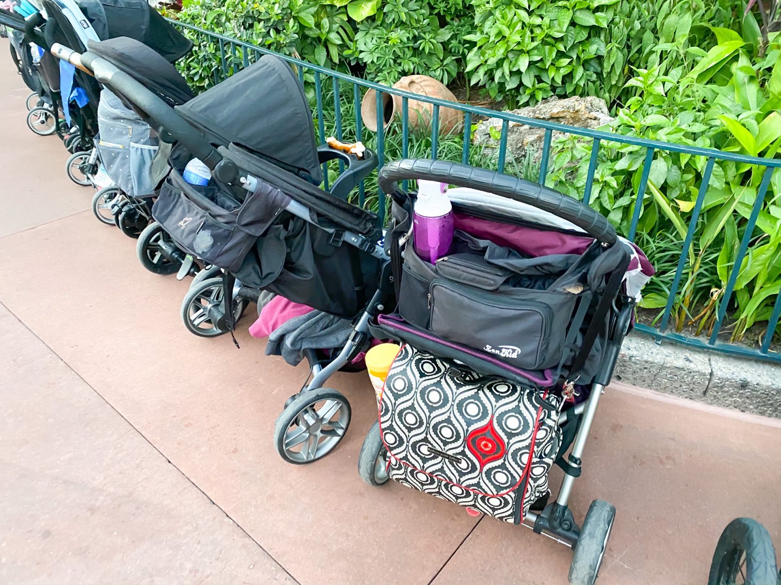 Strollers at Disney are lined up on the sides to be out of the way while guests are on rides, eating, or at shows.