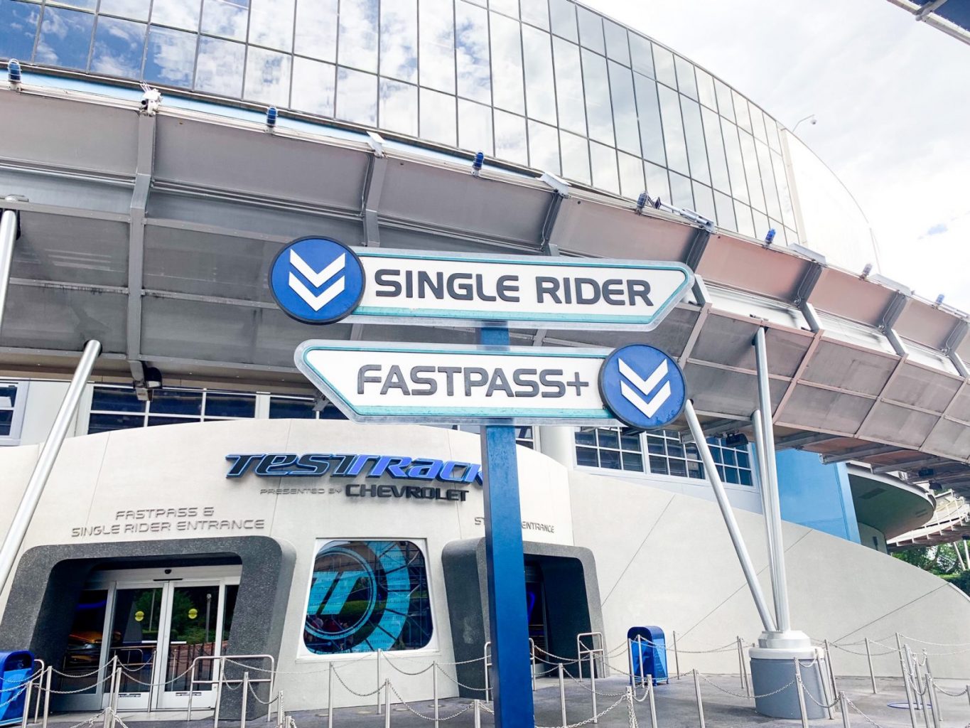disney single rider line sign next to FastPass sign outside the entrance of Test Track in Epcot