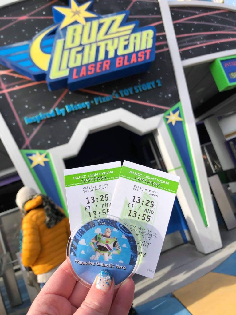 Buzz Lightyear Laser Blast paper fastpasses in front of the entrance to the ride