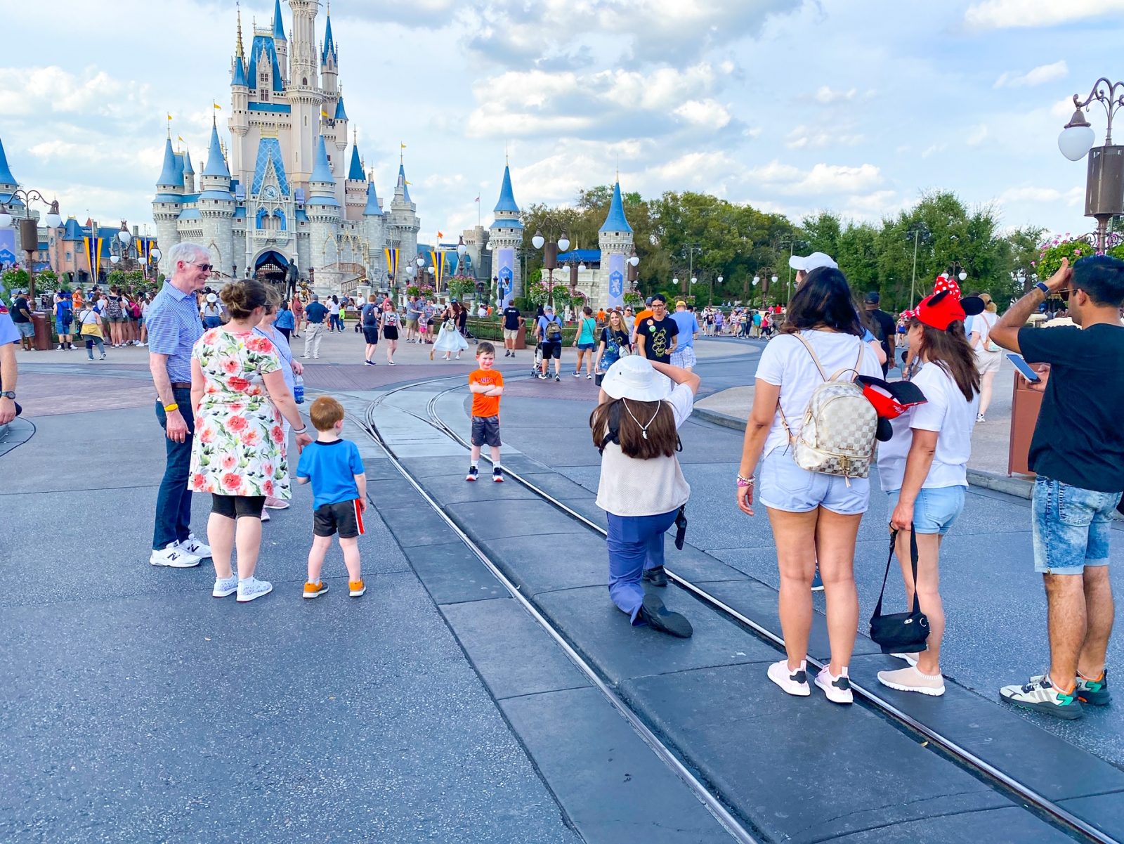 This photopass line in front of Cinderella's castle shows an example of how people line up to use Disney Memory Maker.