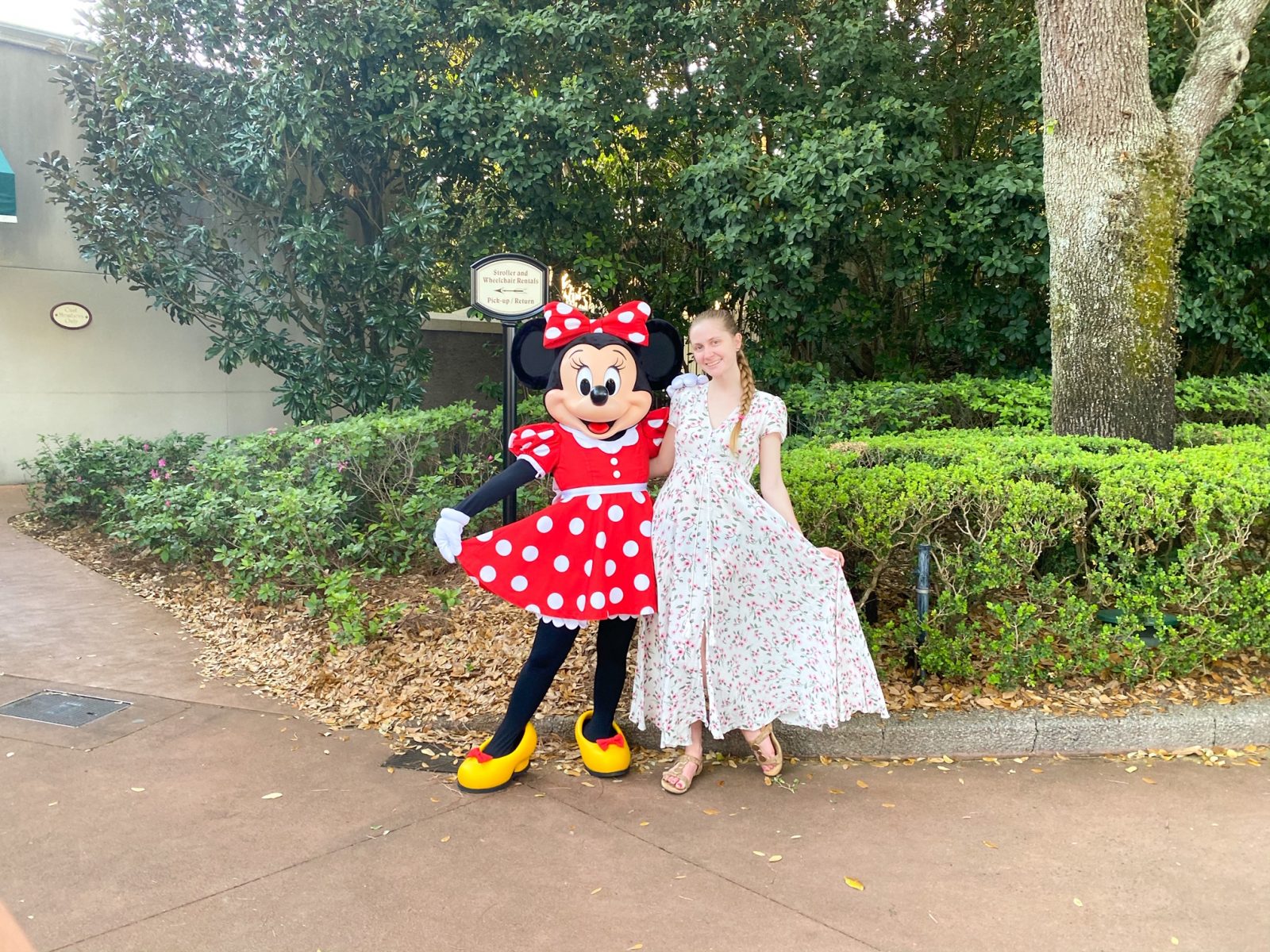 Victoria with a Disney Memory Maker photo that features Minnie Mouse! Both wear cute dresses. 
