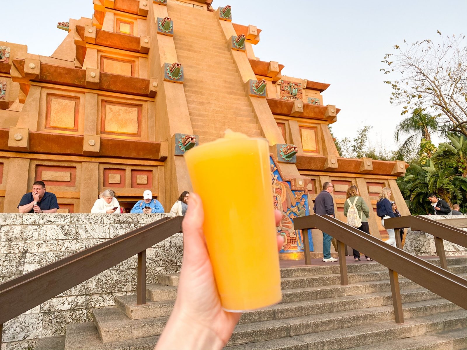 woman holding Mexico margarita while drinking around the world at Epcot
