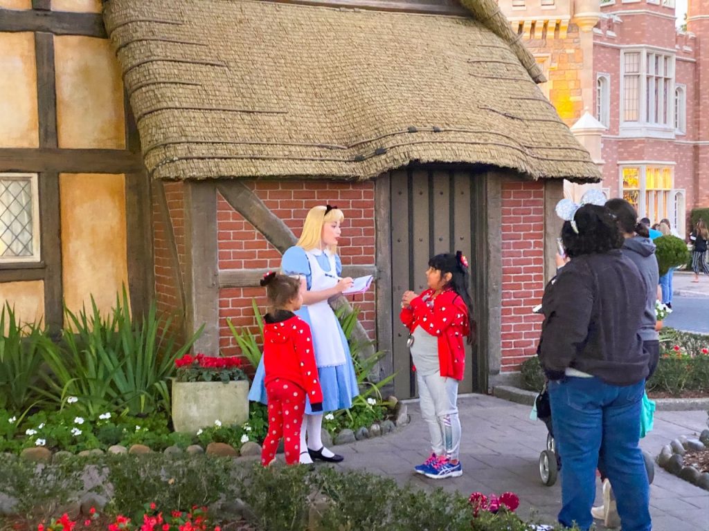 photo of children meeting a character; another of the best things to do at Epcot